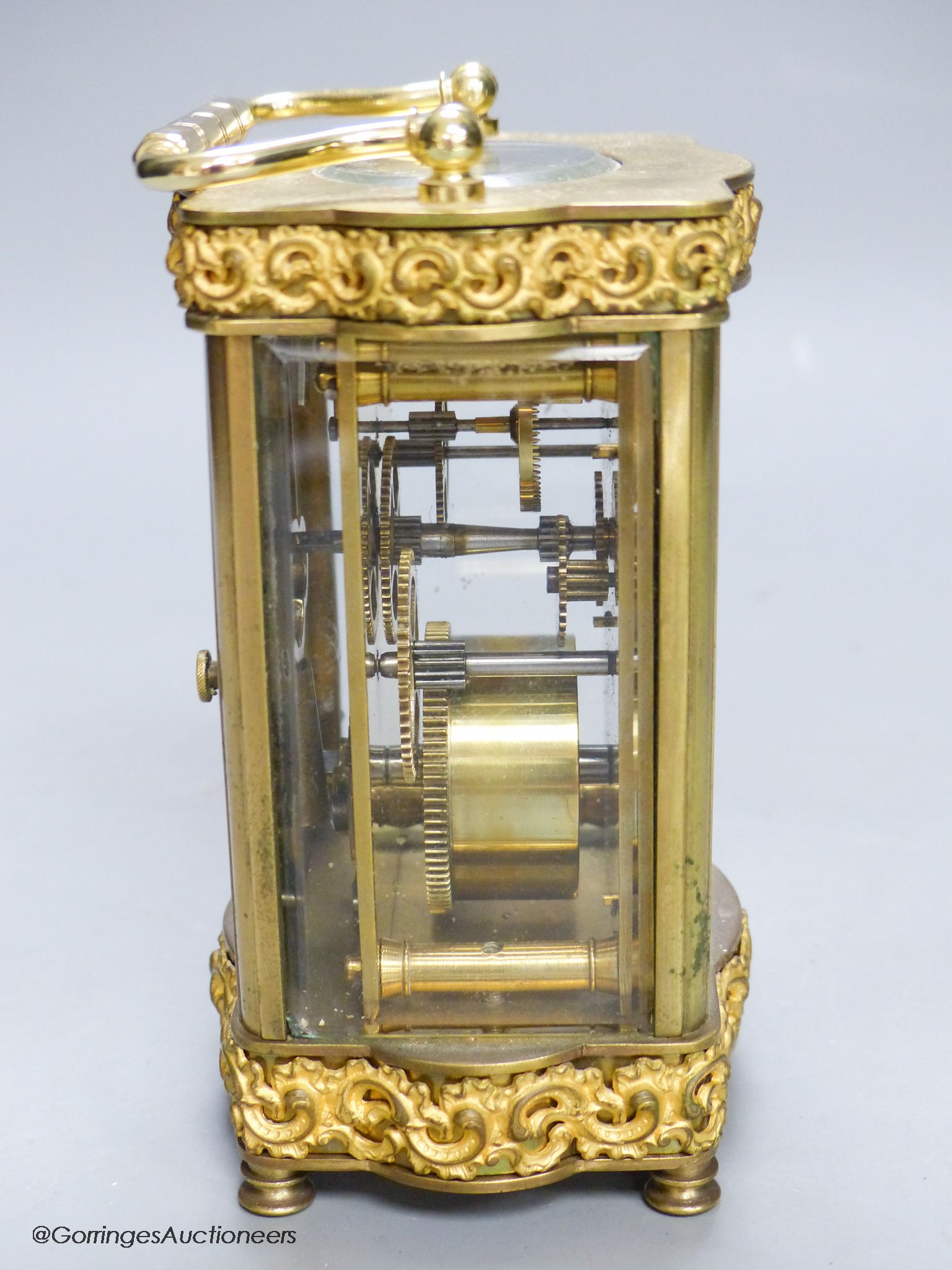 An Edwardian serpentine brass carriage timepiece, height 12cm